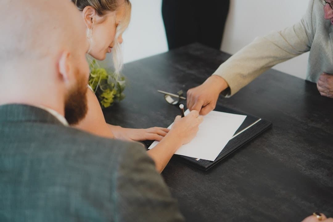 Couple signing mortgage documents